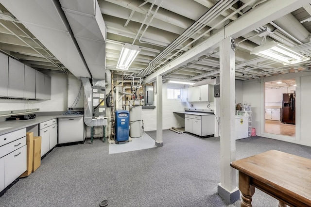 360 W Maple St, Lombard, IL 60148 - basement featuring heating unit, electric panel, and black refrigerator with ice dispenser