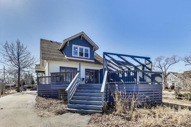360 W Maple St, Lombard, IL 60148 - view of front of home with a wooden deck, a shingled roof, and stairs