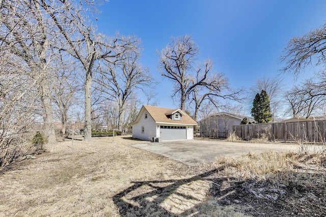 360 W Maple St, Lombard, IL 60148 - view of home's exterior with fence, an outdoor structure, and dirt driveway