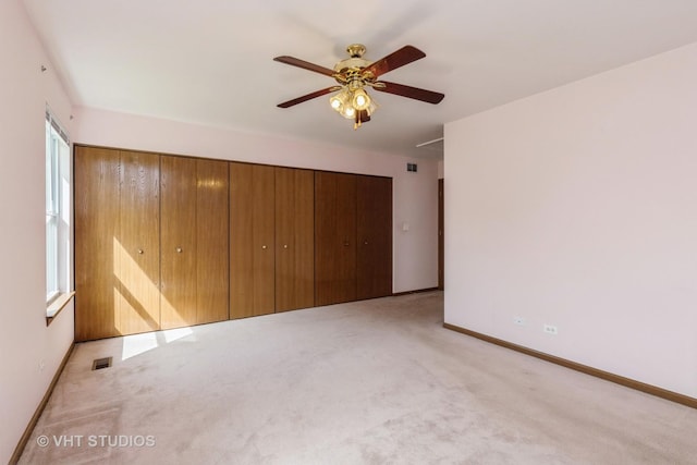 7 N Brittany Ln, Hainesville, IL 60030 - unfurnished bedroom featuring carpet floors, baseboards, a closet, and ceiling fan
