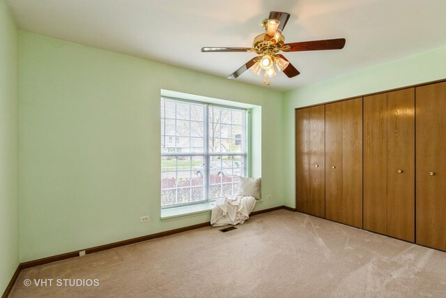 7 N Brittany Ln, Hainesville, IL 60030 - unfurnished bedroom with carpet floors, multiple windows, a closet, and baseboards