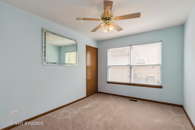 7 N Brittany Ln, Hainesville, IL 60030 - empty room featuring light carpet, baseboards, and ceiling fan