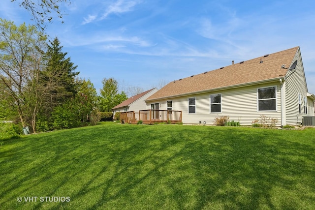 7 N Brittany Ln, Hainesville, IL 60030 - rear view of house with a deck, a yard, a shingled roof, and central AC