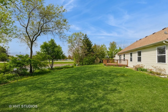 7 N Brittany Ln, Hainesville, IL 60030 - view of green lawn featuring a deck
