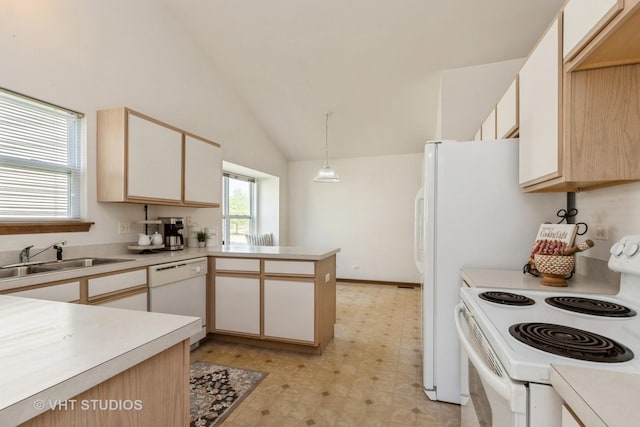 7 N Brittany Ln, Hainesville, IL 60030 - kitchen with white appliances, a sink, light countertops, light floors, and a peninsula