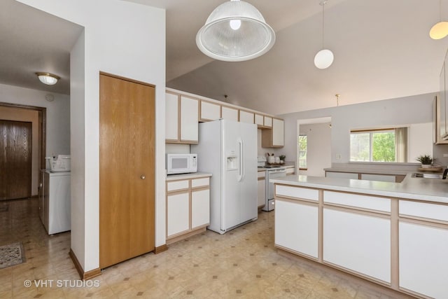 7 N Brittany Ln, Hainesville, IL 60030 - kitchen featuring white appliances, washer / dryer, light flooring, light countertops, and pendant lighting