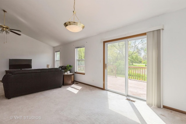 7 N Brittany Ln, Hainesville, IL 60030 - living area featuring light carpet, ceiling fan, lofted ceiling, and baseboards