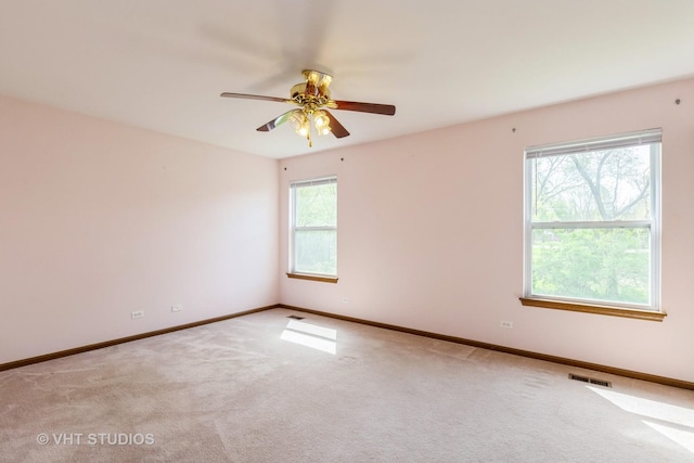 7 N Brittany Ln, Hainesville, IL 60030 - spare room with carpet, baseboards, and ceiling fan