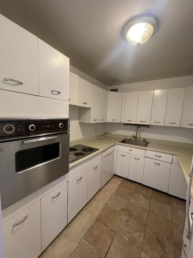 4800 S Chicago Beach Dr Unit 2614N, Chicago, IL 60615 - kitchen featuring oven, white dishwasher, a sink, electric cooktop, and white cabinetry