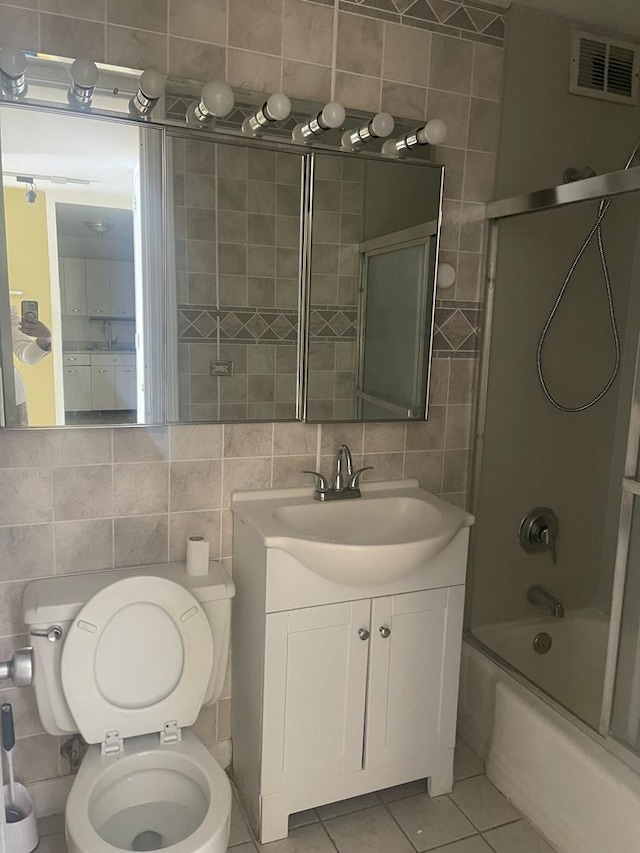 4800 S Chicago Beach Dr Unit 2614N, Chicago, IL 60615 - bathroom featuring tile walls, tile patterned flooring, backsplash, shower / tub combination, and vanity