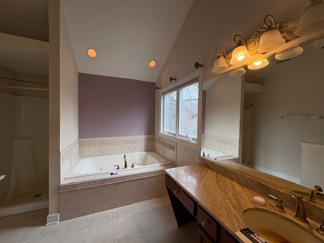 full bathroom with vanity, a shower, lofted ceiling, tile patterned floors, and a bath