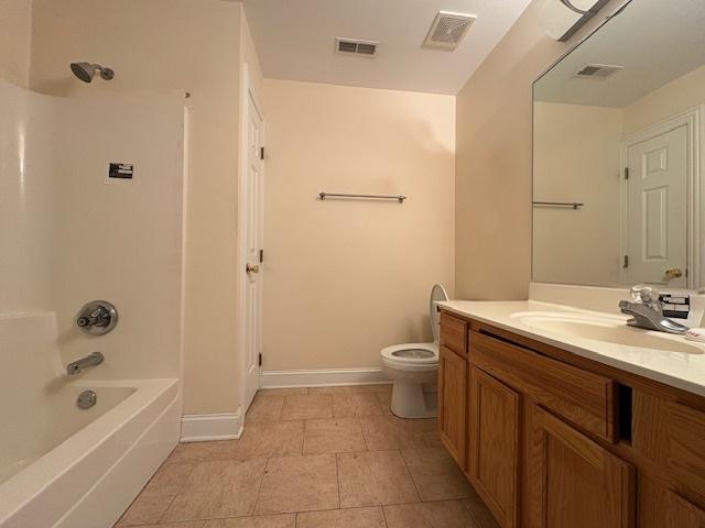 full bath featuring shower / bath combination, vanity, toilet, and visible vents