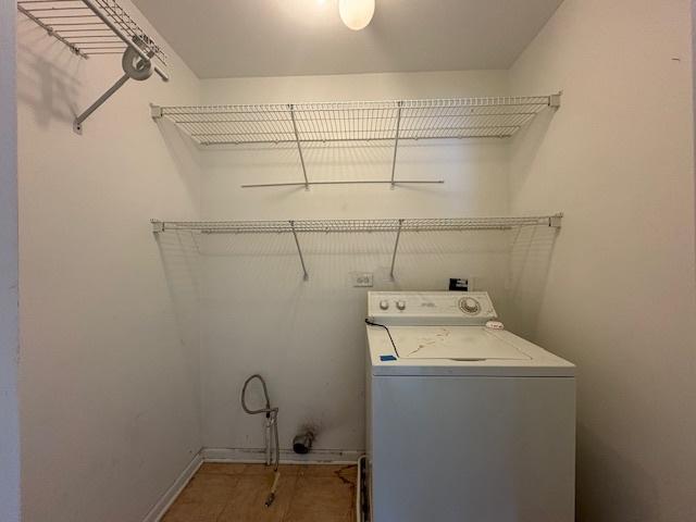washroom featuring laundry area and washer / dryer