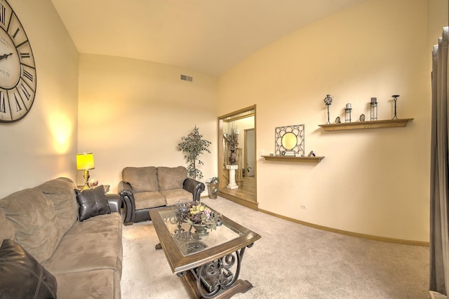 living area featuring visible vents, baseboards, and carpet floors