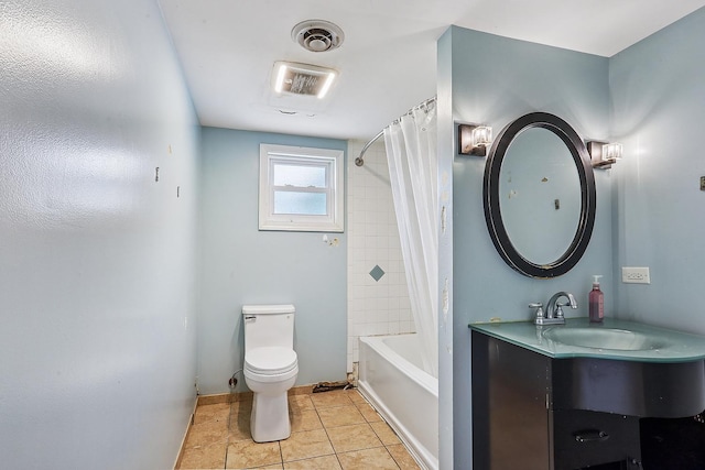 bathroom featuring toilet, tile patterned floors, baseboards, vanity, and shower / tub combo
