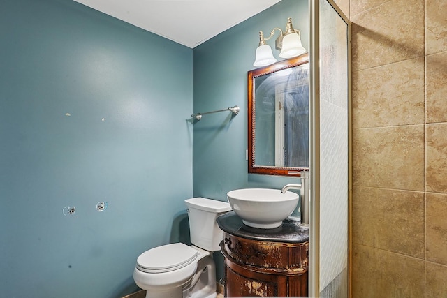bathroom with toilet and vanity