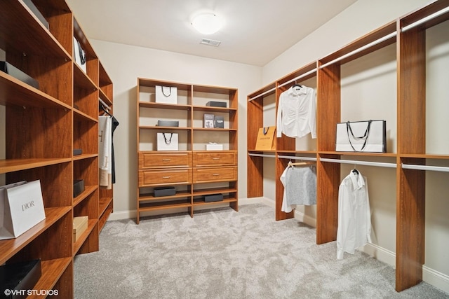 spacious closet with carpet floors and visible vents