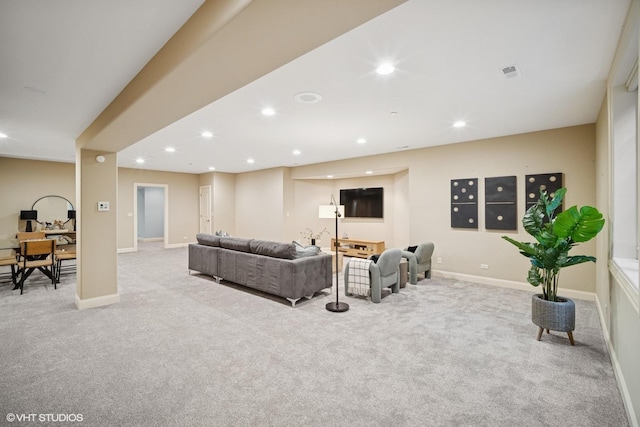 carpeted living room featuring recessed lighting, baseboards, and visible vents