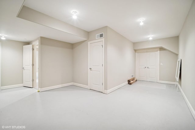 finished basement featuring baseboards and visible vents