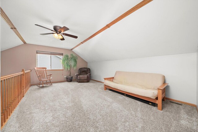 sitting room featuring visible vents, carpet flooring, ceiling fan, and vaulted ceiling