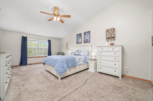 bedroom with baseboards, light carpet, ceiling fan, and high vaulted ceiling