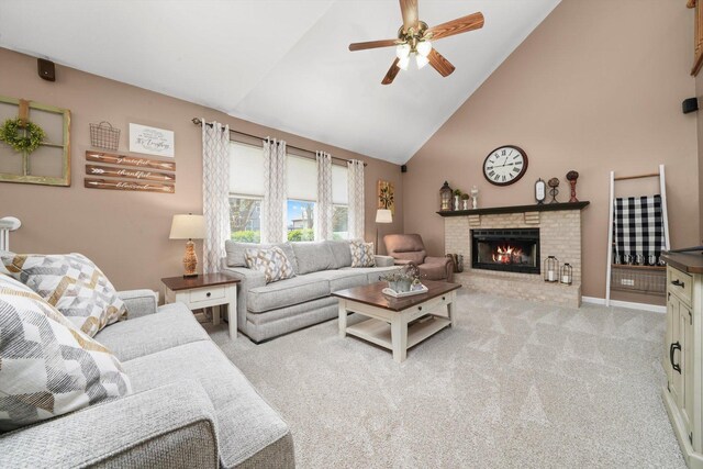 living area featuring a brick fireplace, carpet, ceiling fan, and high vaulted ceiling