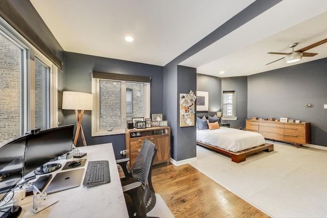 bedroom with baseboards and wood finished floors