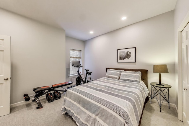 carpeted bedroom featuring baseboards and recessed lighting