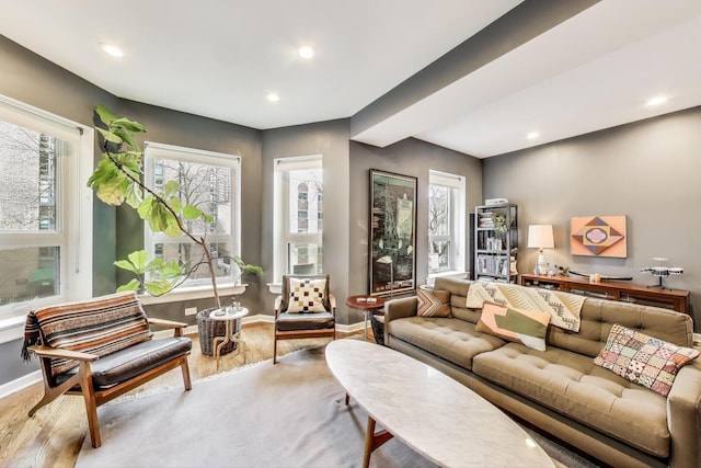 living area featuring baseboards, recessed lighting, and wood finished floors