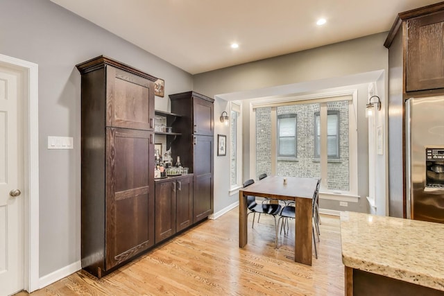 dining area with baseboards, recessed lighting, and light wood-style flooring