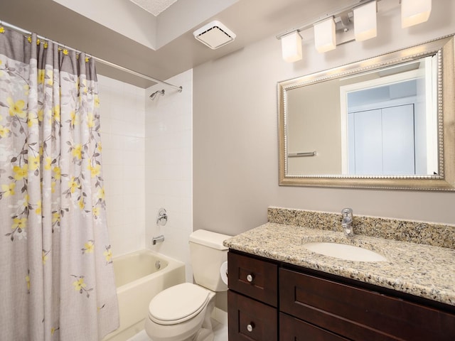 full bath with vanity, shower / bath combo, and toilet