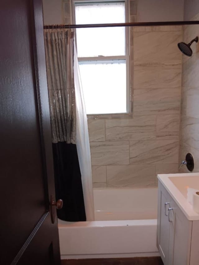 bathroom with vanity and shower / bathtub combination with curtain