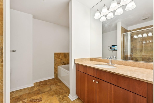 125 S Green St Unit 1007A, Chicago, IL 60607 - bathroom with vanity, a stall shower, a bath, baseboards, and stone finish flooring