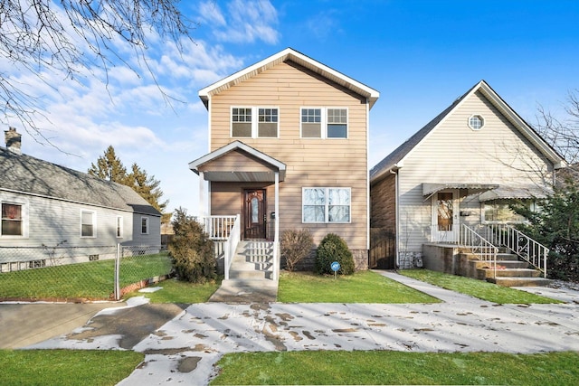 view of front of property with fence and a front yard