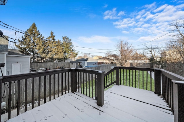wooden terrace with a lawn and a fenced backyard
