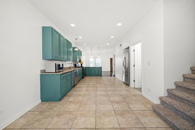 kitchen with pendant lighting, light tile patterned floors, a sink, stainless steel appliances, and recessed lighting