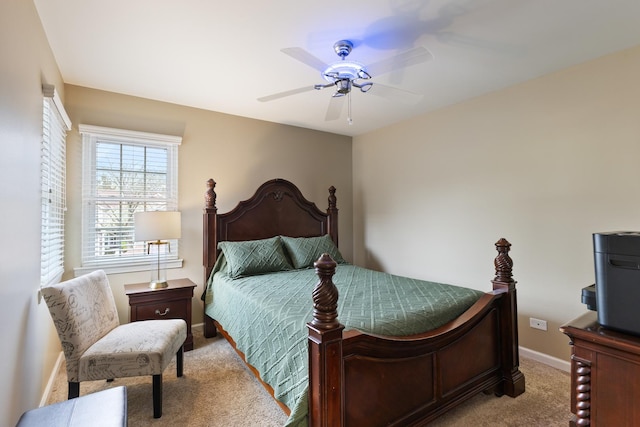 bedroom featuring baseboards, ceiling fan, and carpet