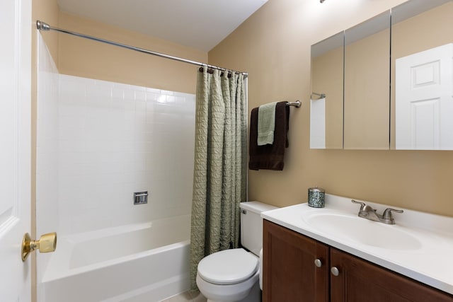 full bathroom with vanity, toilet, and shower / tub combo