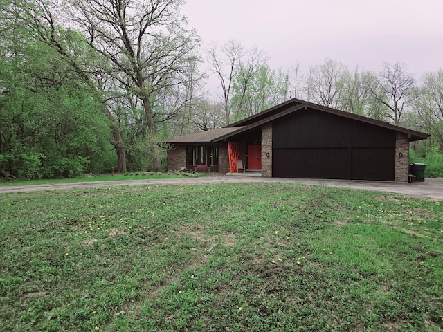 38W443 Woodhill Ln, Saint Charles, IL 60175 - view of front of home featuring brick siding, driveway, a front yard, and a garage