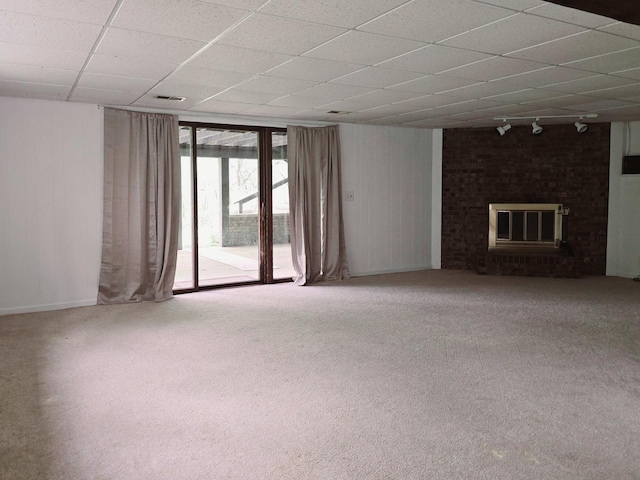 38W443 Woodhill Ln, Saint Charles, IL 60175 - unfurnished living room with a drop ceiling, a brick fireplace, track lighting, wooden walls, and carpet flooring