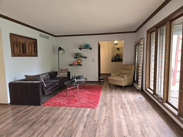 38W443 Woodhill Ln, Saint Charles, IL 60175 - living room featuring a textured ceiling, a wealth of natural light, and wood finished floors