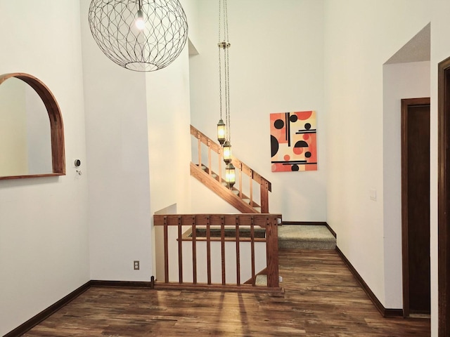 38W443 Woodhill Ln, Saint Charles, IL 60175 - hall with baseboards, wood finished floors, stairway, and a towering ceiling