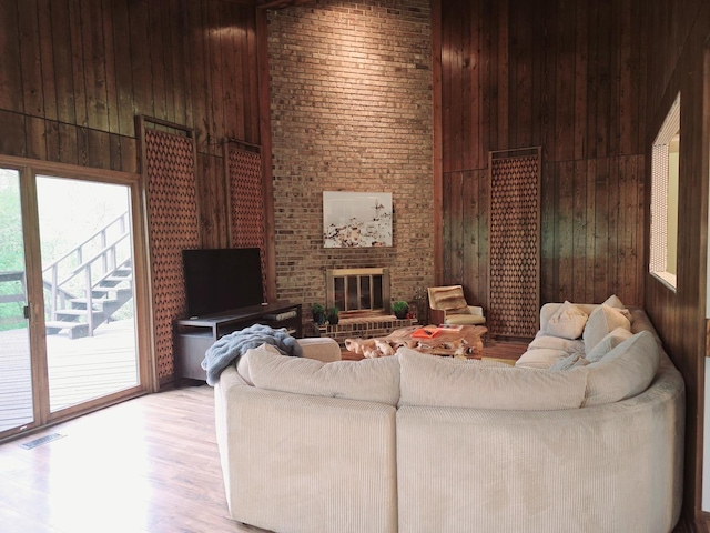 38W443 Woodhill Ln, Saint Charles, IL 60175 - living room with wooden walls, visible vents, wood finished floors, and a towering ceiling