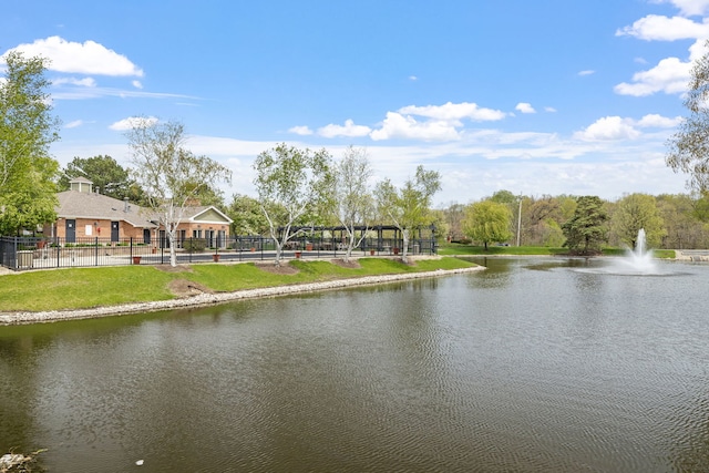 property view of water featuring fence