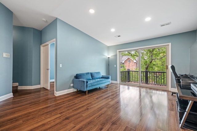 living area with baseboards, recessed lighting, wood finished floors, and visible vents