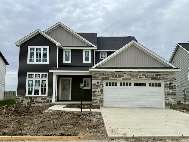 craftsman inspired home featuring board and batten siding, driveway, an attached garage, a shingled roof, and stone siding