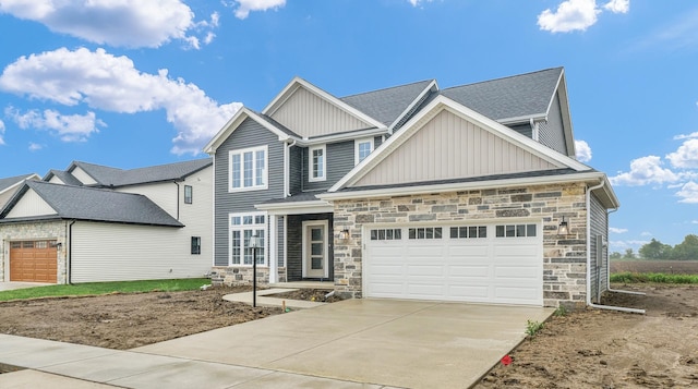 407 Sutton St, Savoy, IL 61874 - craftsman-style house featuring board and batten siding, stone siding, driveway, and a garage
