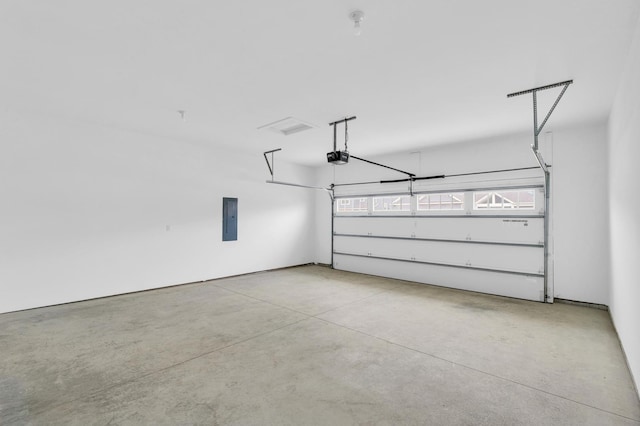 407 Sutton St, Savoy, IL 61874 - garage with electric panel and a garage door opener
