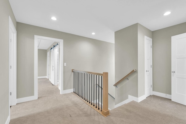 407 Sutton St, Savoy, IL 61874 - hallway featuring an upstairs landing, carpet, baseboards, and recessed lighting