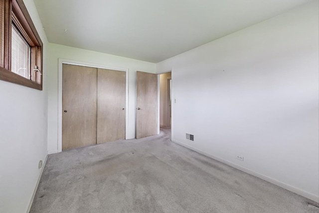 621 N Hamlin Ave, Park Ridge, IL 60068 - unfurnished bedroom featuring visible vents, carpet, baseboards, and a closet